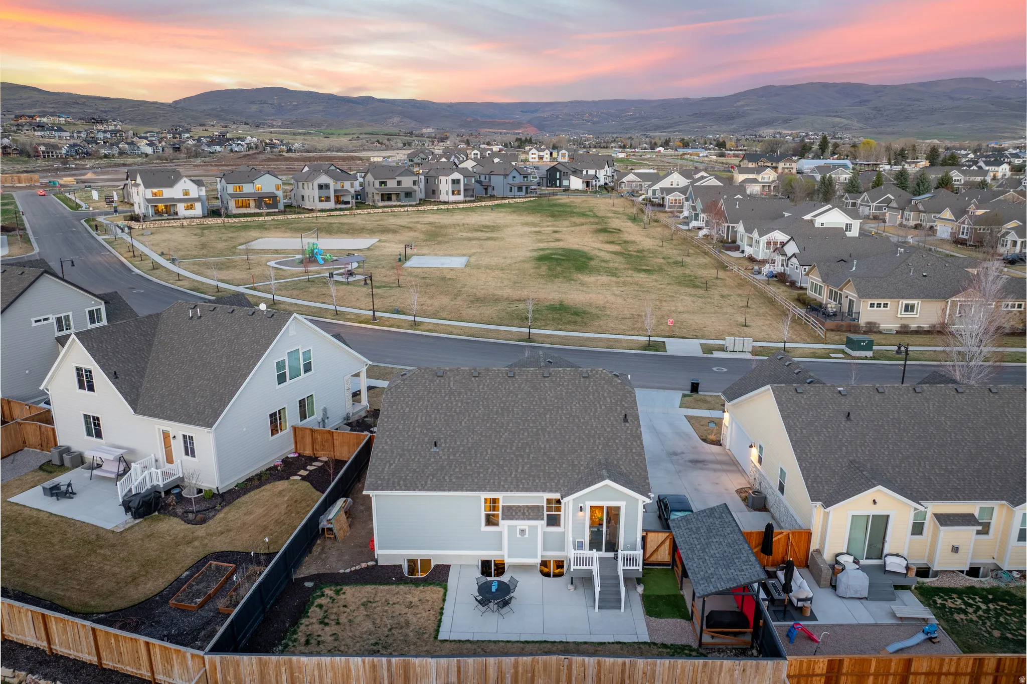 Aerial view of residential area featuring a mountain backdrop