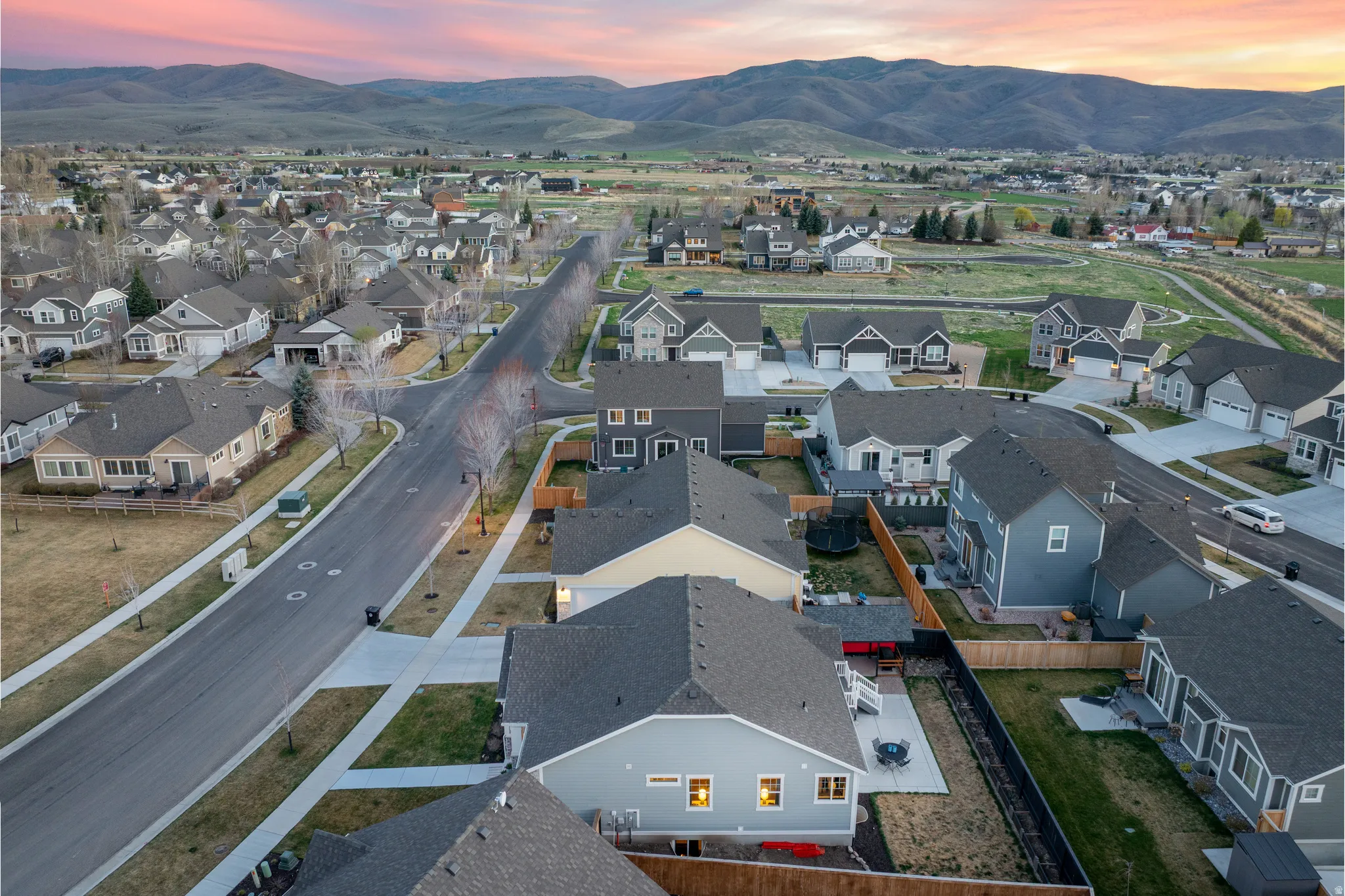 Aerial perspective of suburban area featuring a mountain backdrop