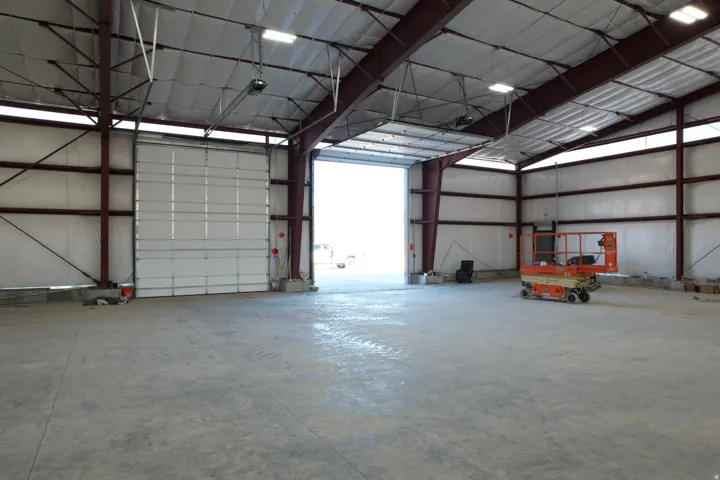 Garage featuring metal wall