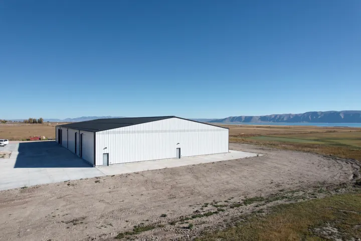 View of outdoor structure featuring a mountain view and a view of rural / pastoral area