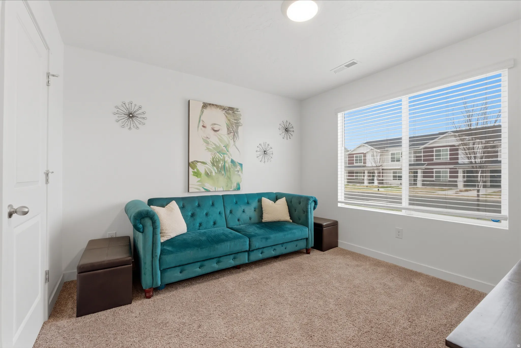 Living room with carpet flooring and baseboards