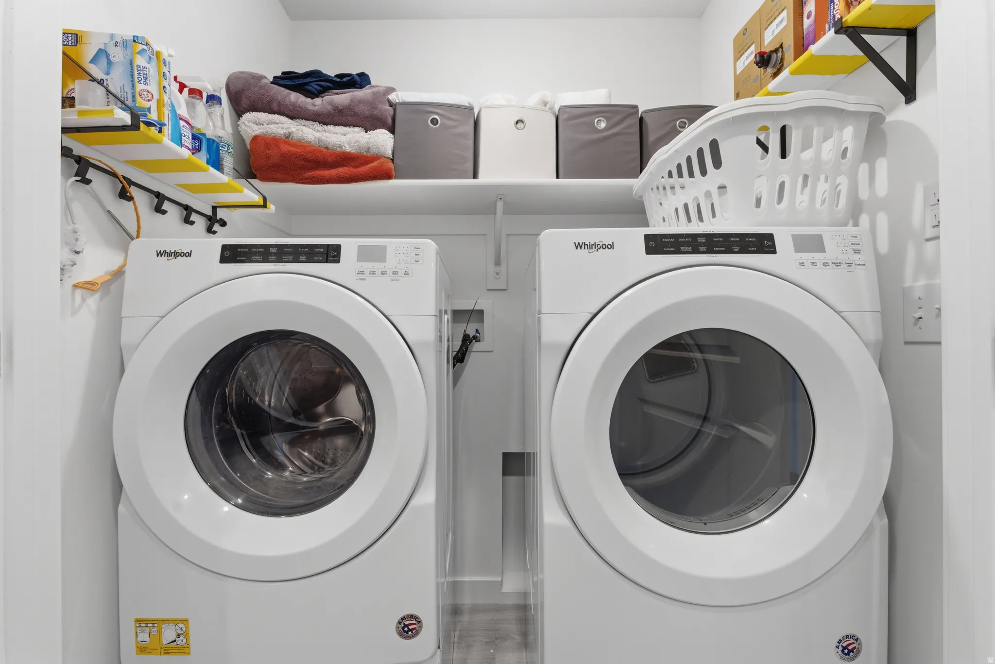 Laundry area with washing machine and clothes dryer