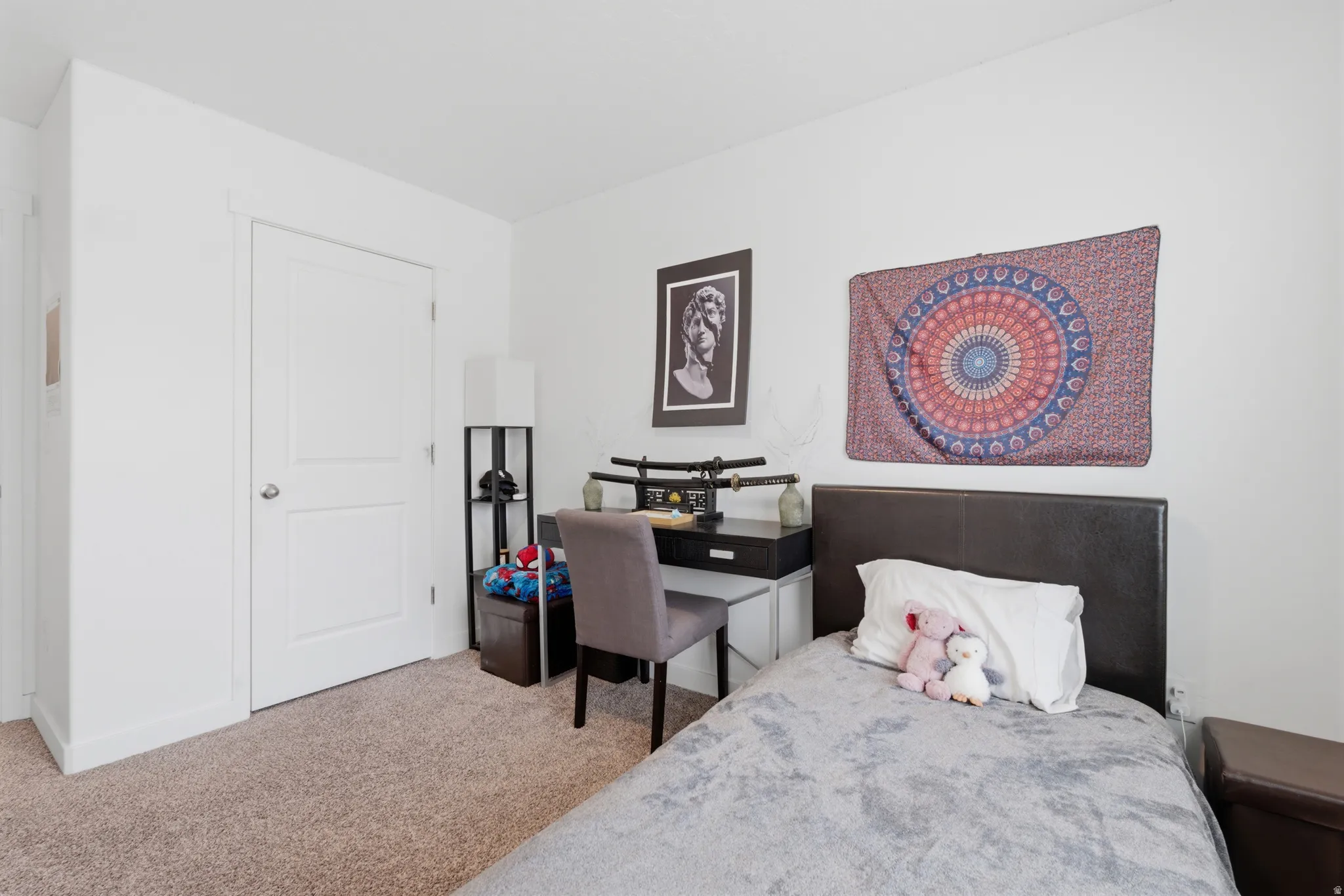 Bedroom with light colored carpet