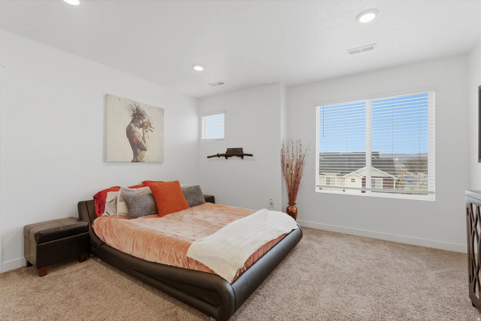 Bedroom with light carpet and recessed lighting