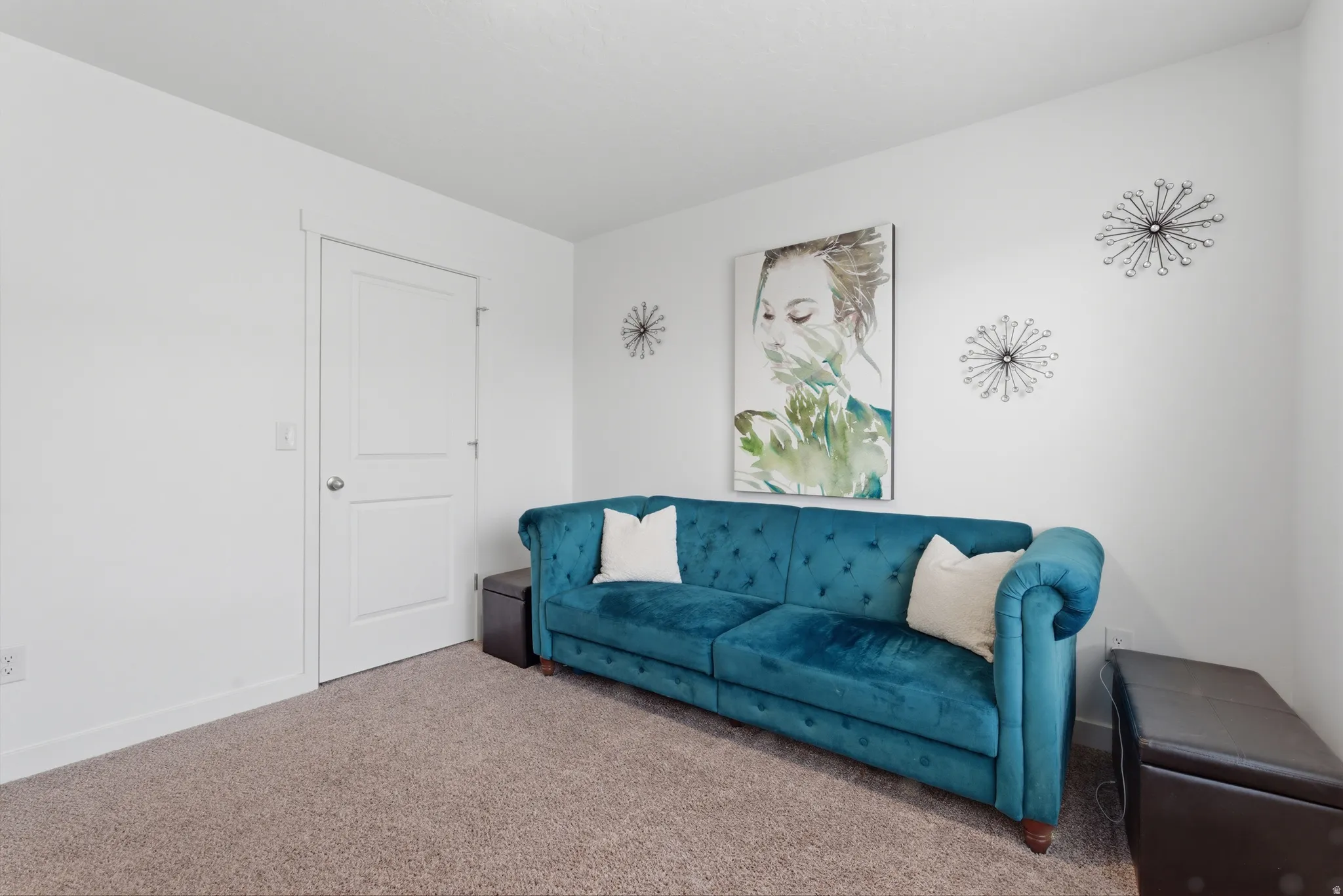 Living room with carpet flooring and baseboards