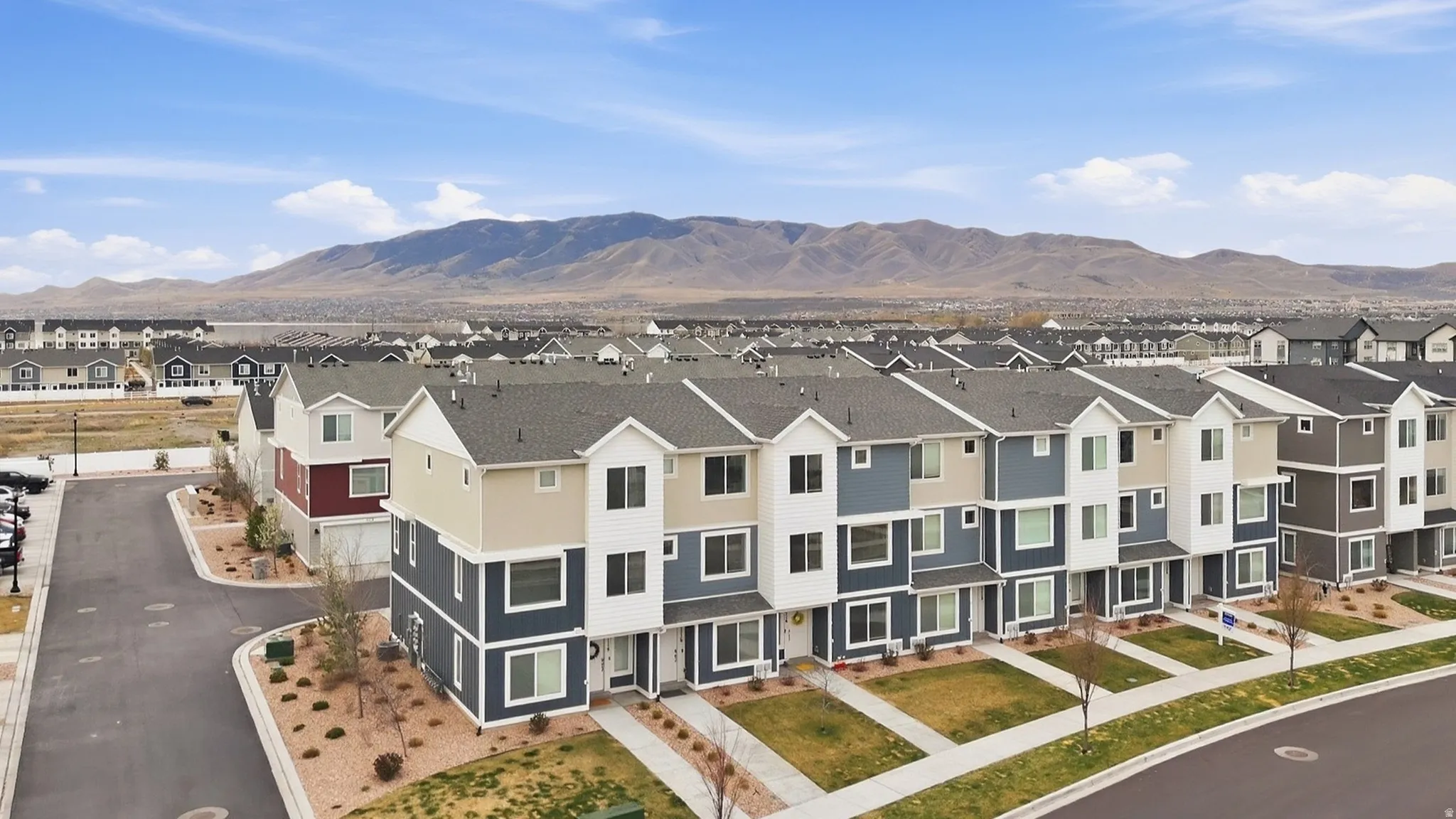 Aerial view of residential area with a mountainous background