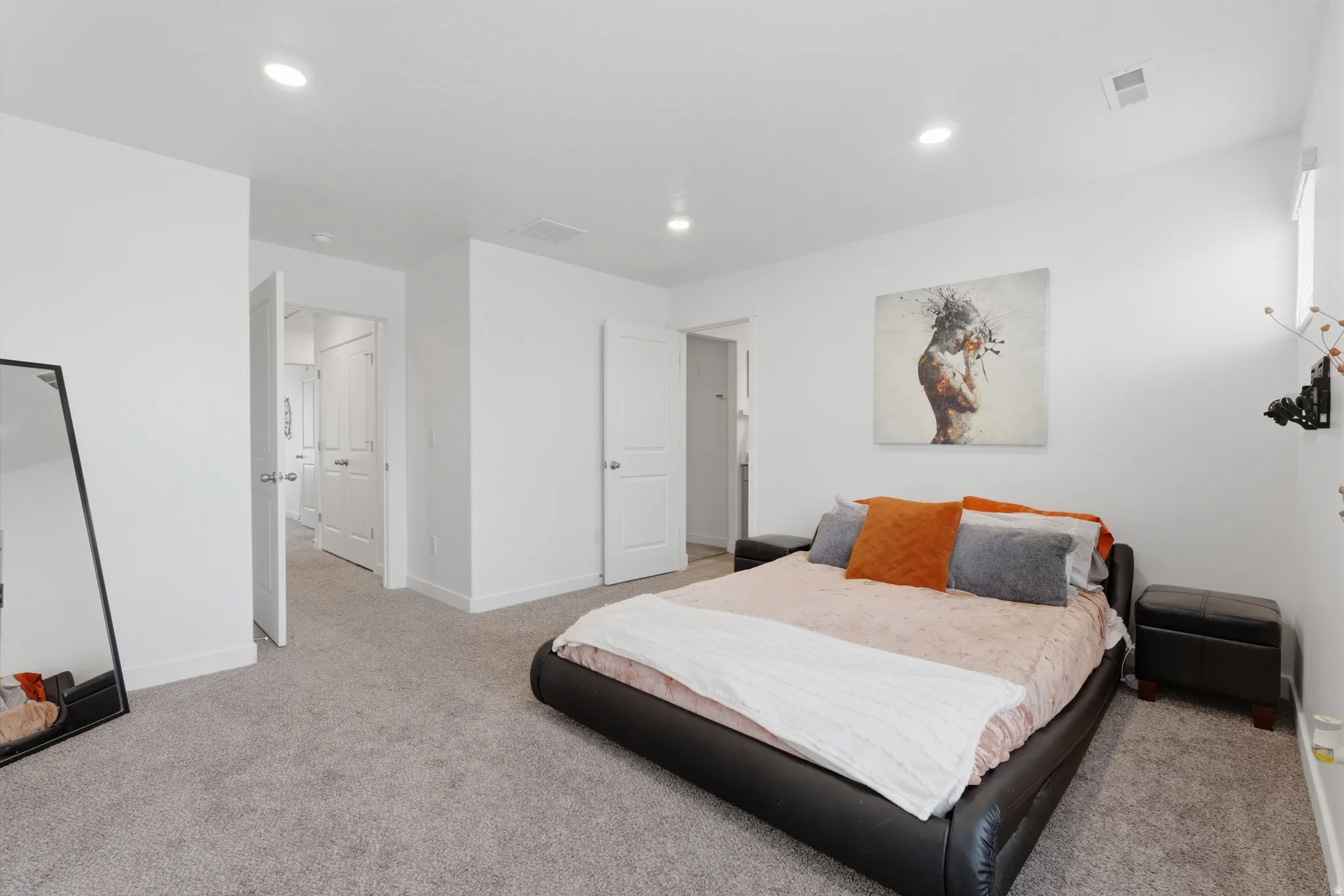 Bedroom featuring light colored carpet and recessed lighting