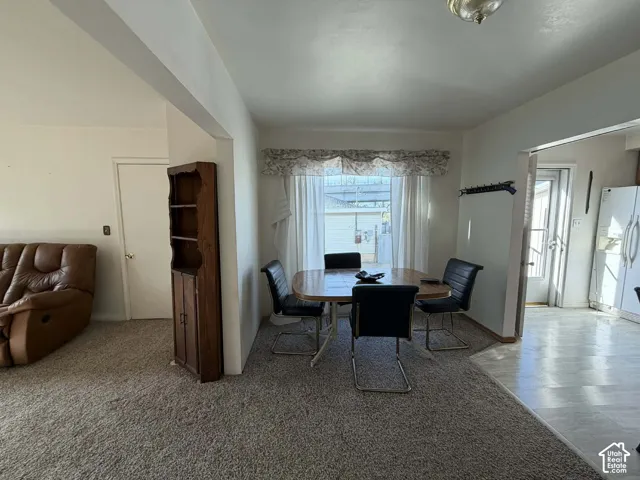 Dining room featuring light carpet