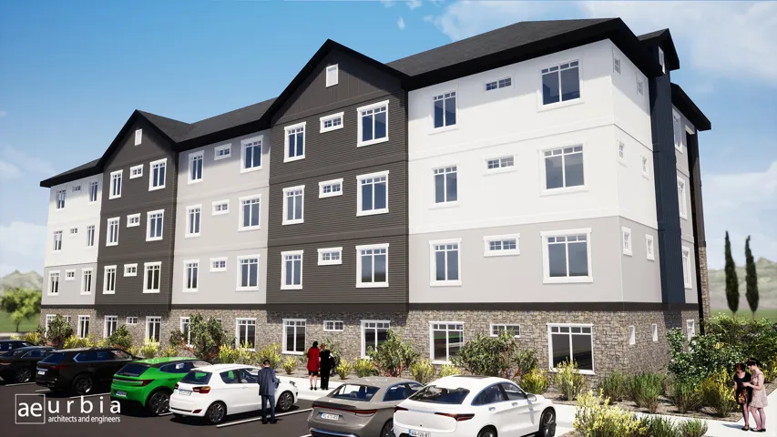 View of apartment building / complex featuring uncovered parking
