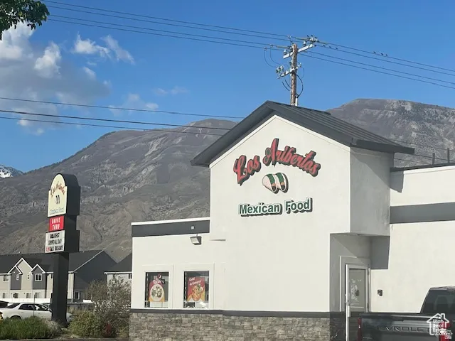 Exterior view of a mountainous background and stucco siding