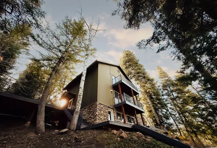 View of property exterior with stone siding