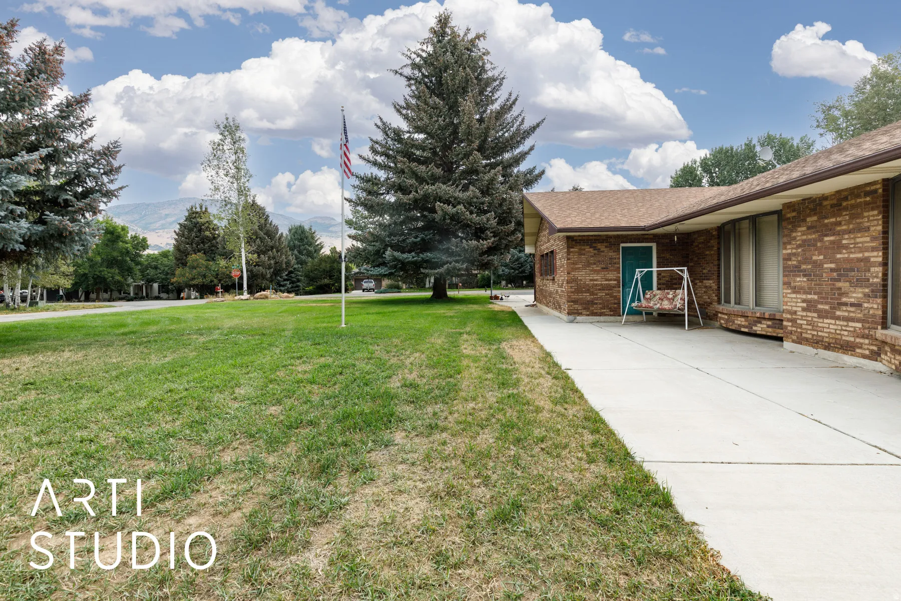 View of grassy yard and front of home