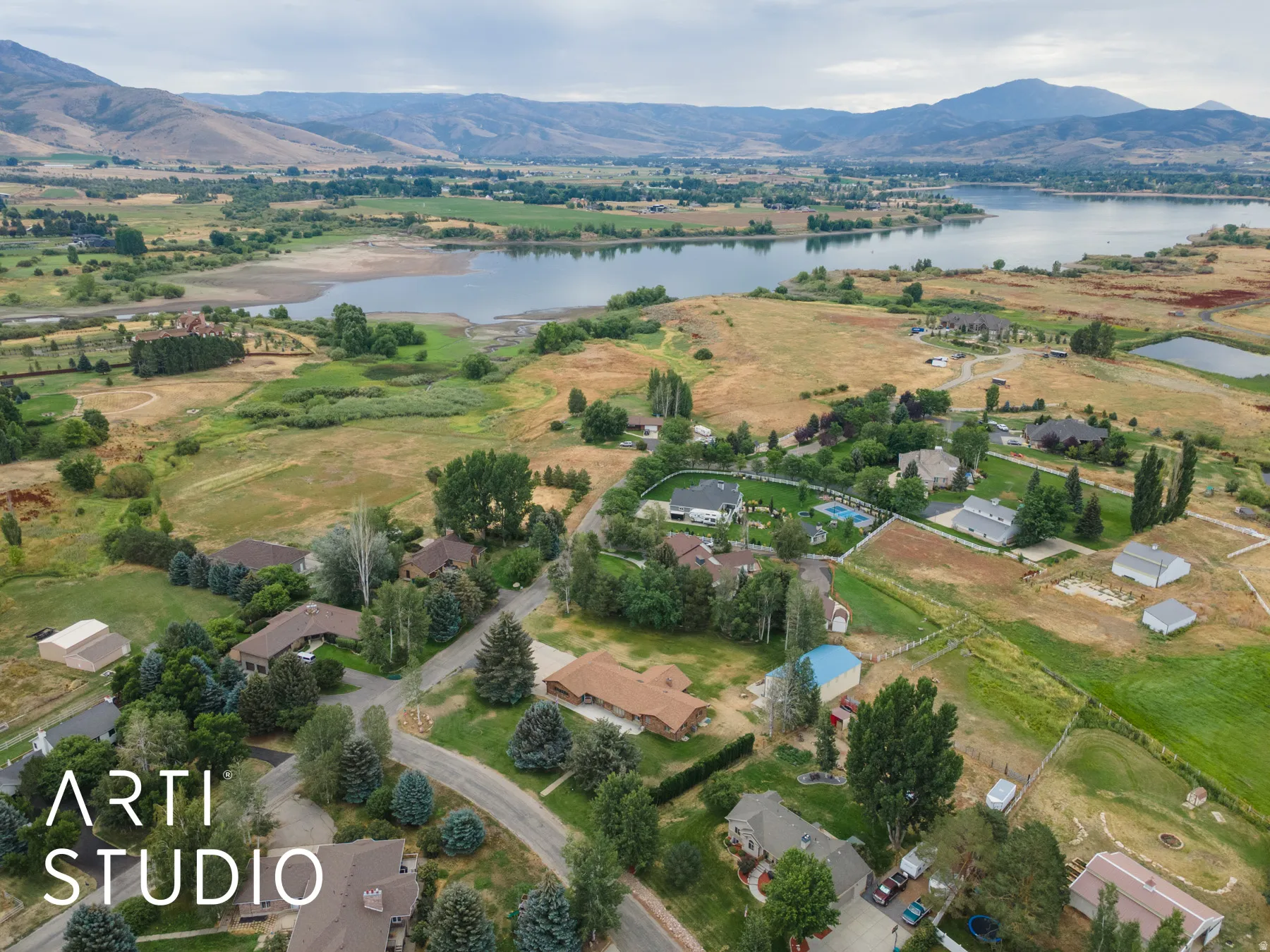 Aerial view of residential area featuring a water and mountain view