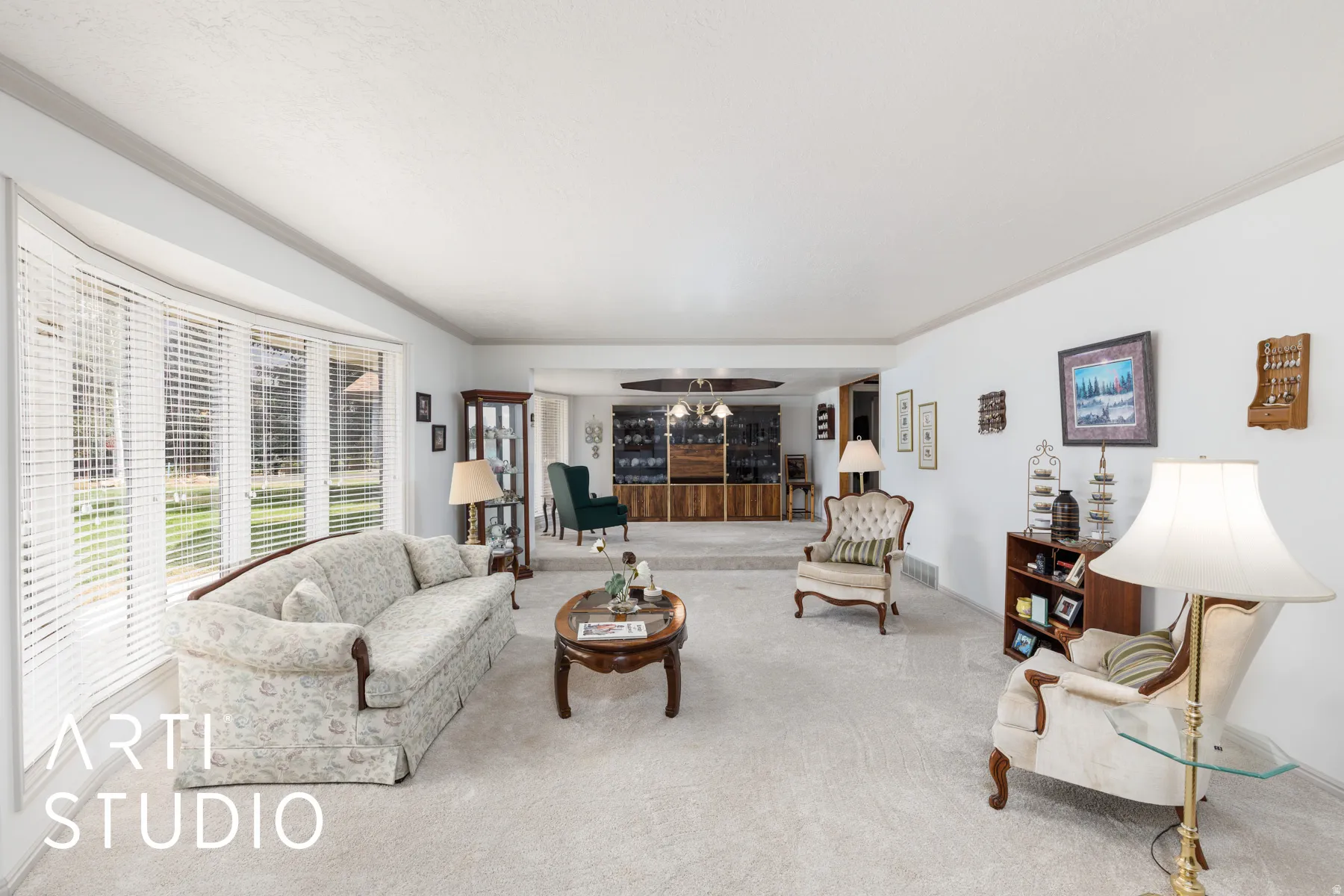 Formal living room with ornamental molding