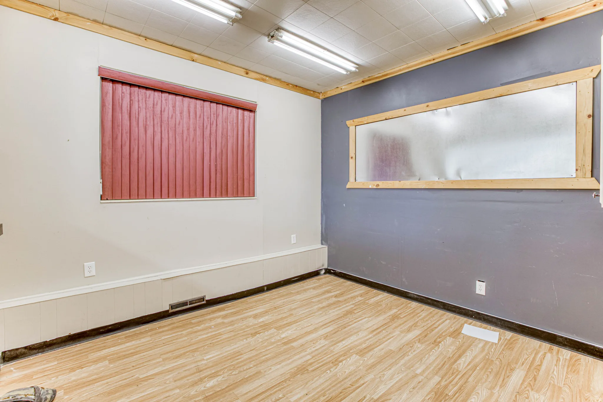 Spare room featuring wood finished floors