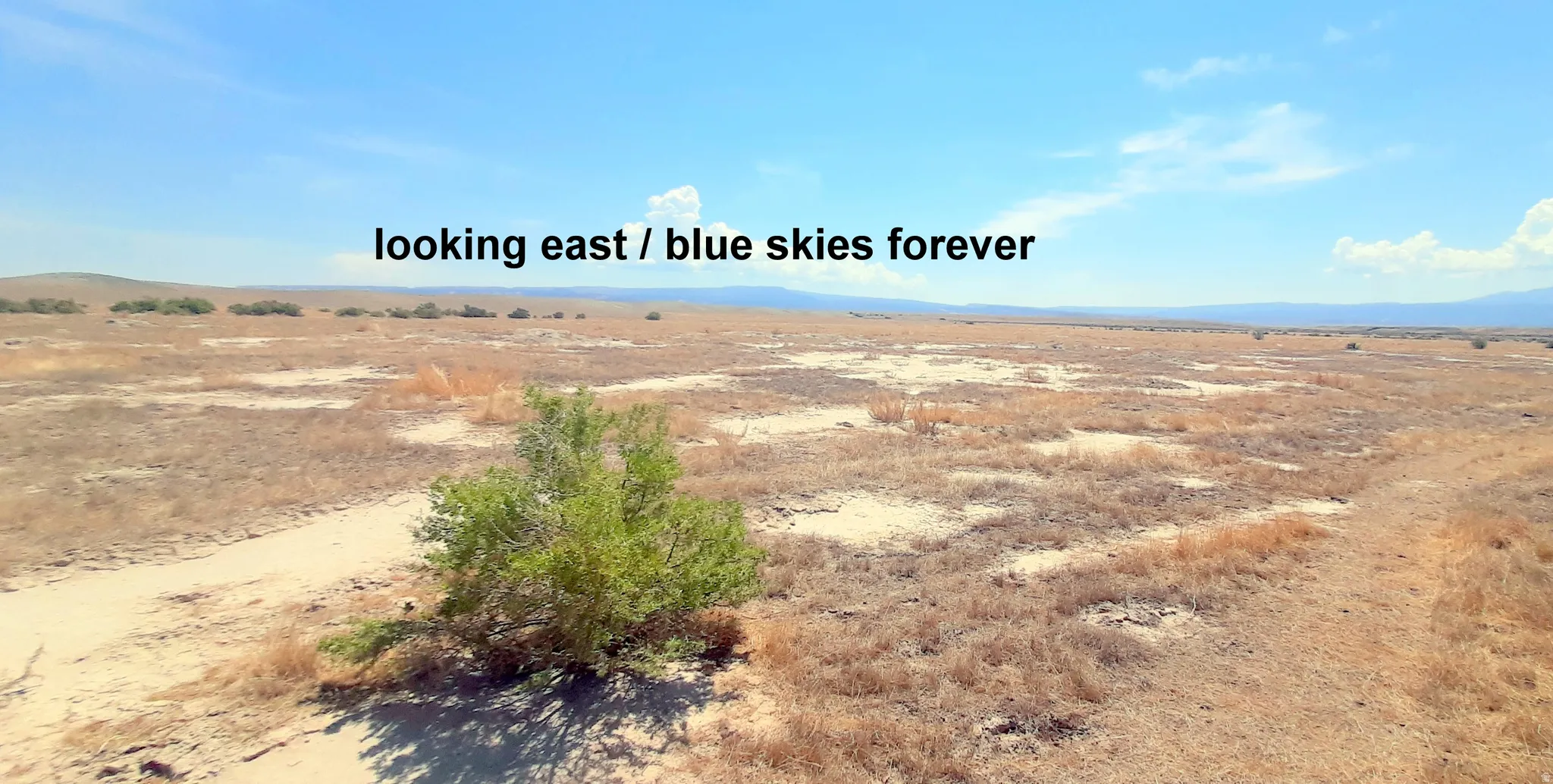 Exterior space featuring a mountainous background and rural landscape.
