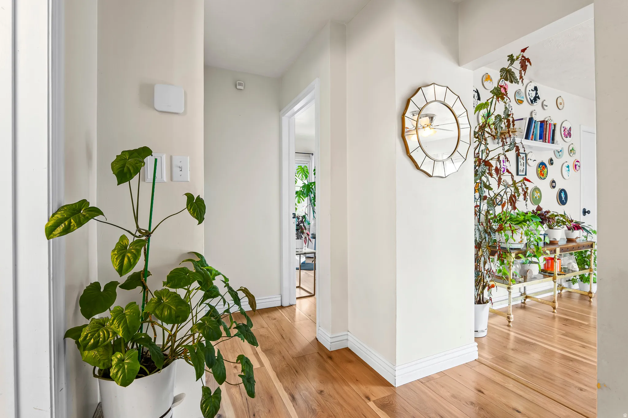 Hallway featuring baseboards and light wood-style flooring