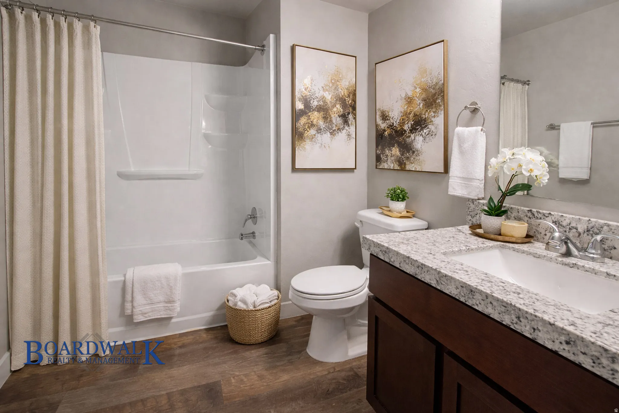 Bathroom featuring vanity, dark wood-style floors, and shower / bath combo