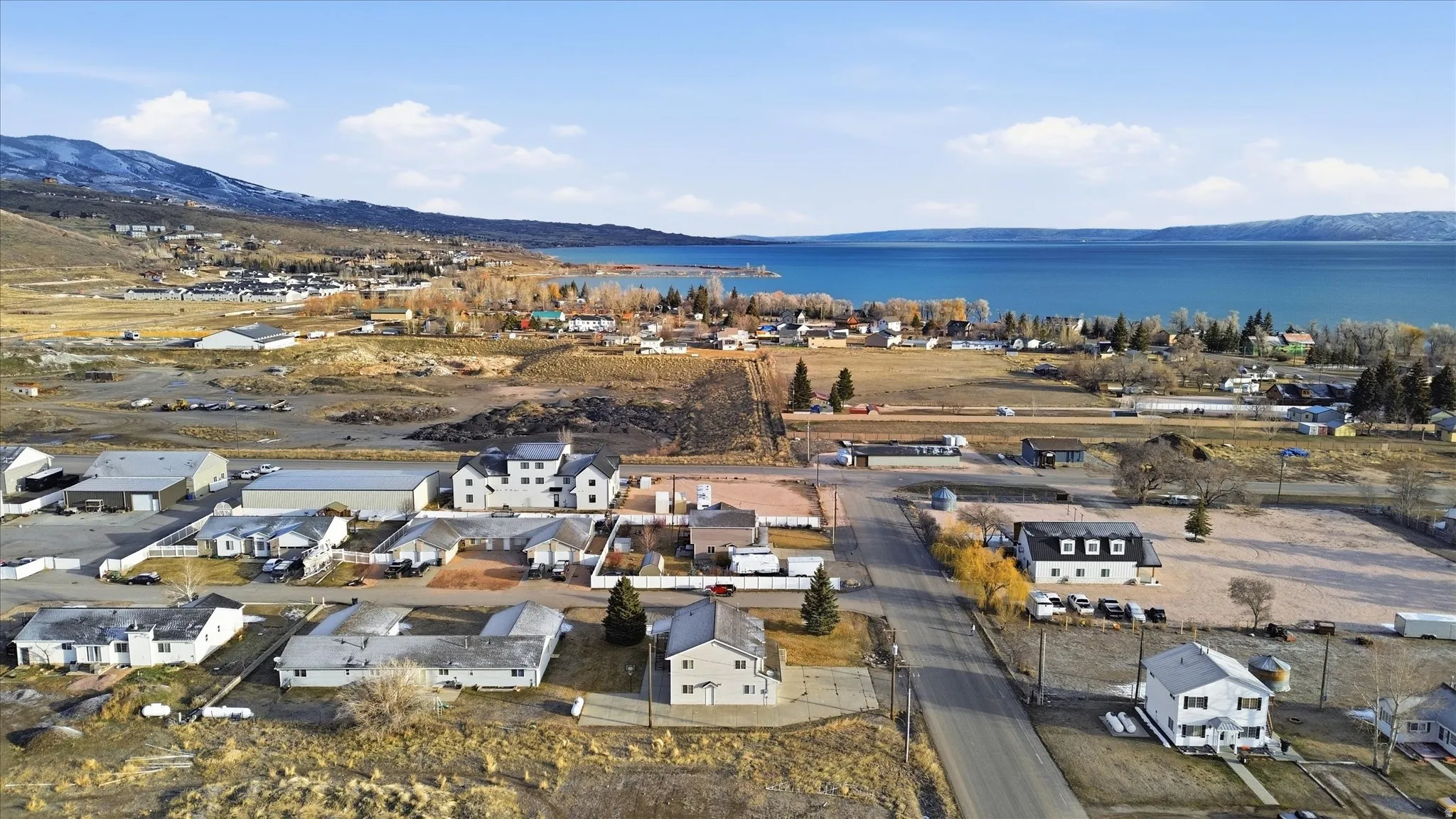 Aerial view of residential area featuring a water and mountain view