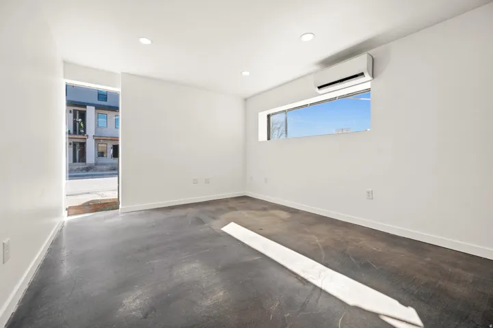 Unfurnished room featuring concrete floors and recessed lighting