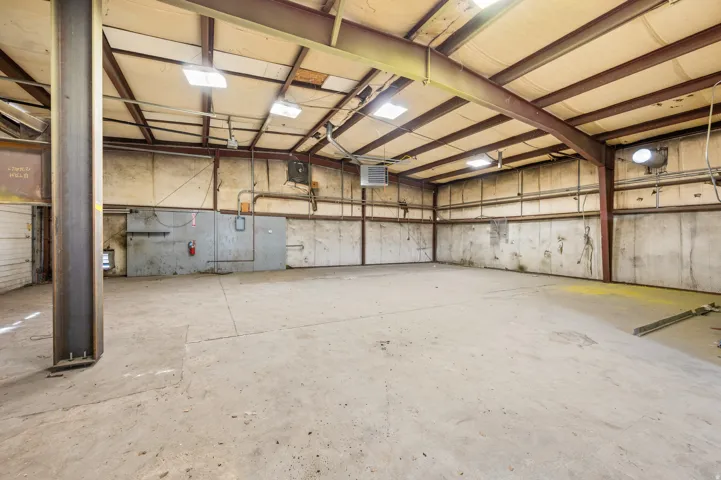Garage featuring a heating unit
