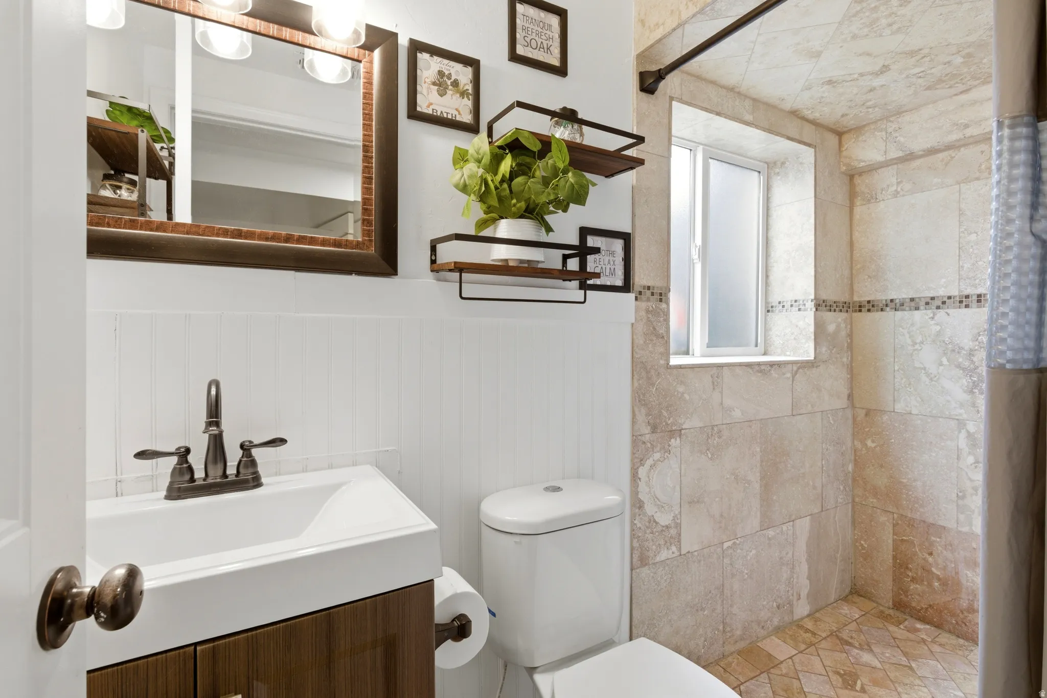 Updated lower level three-quarter bath with oversized shower.