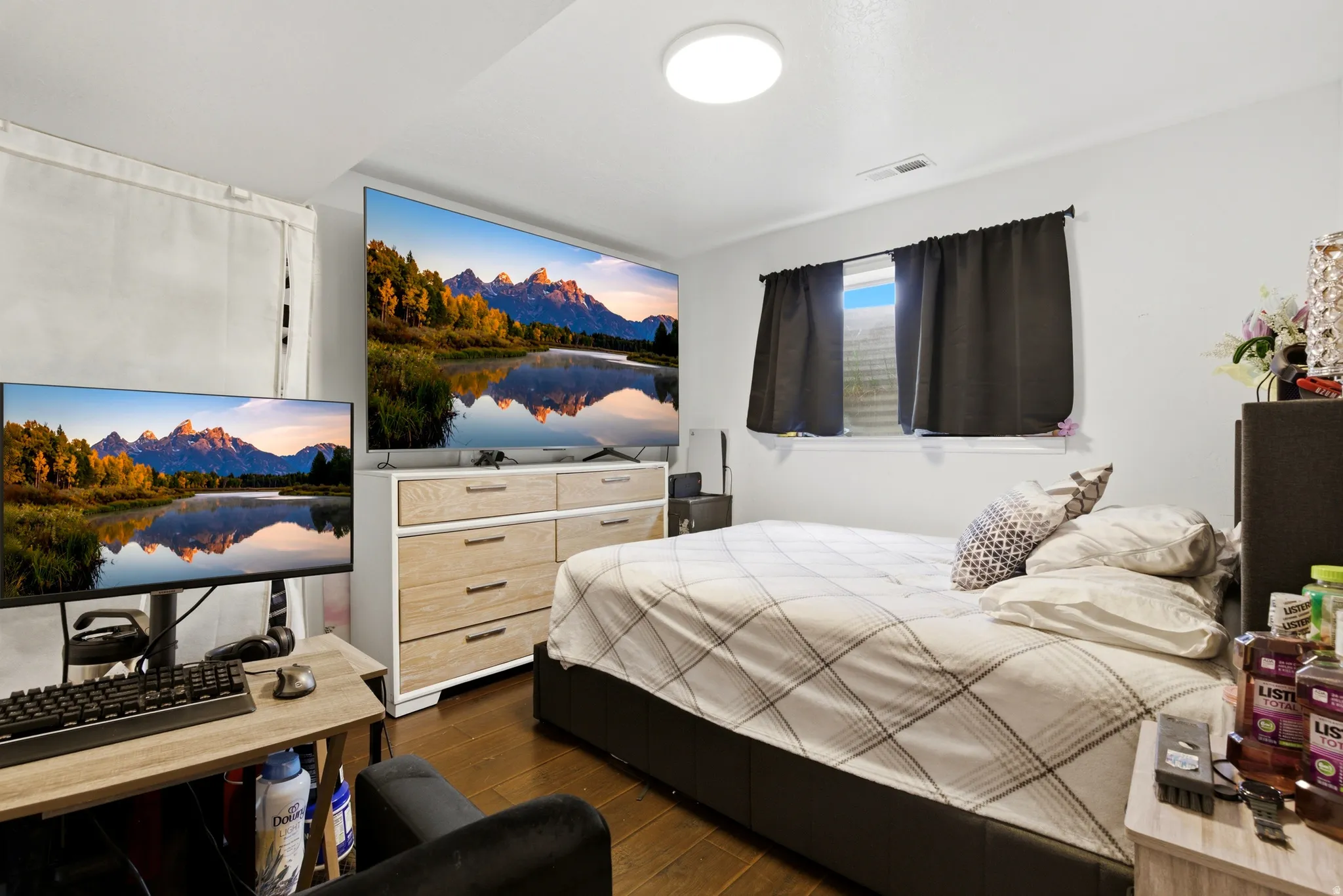 Basement living room, currently being used as a third bedroom.