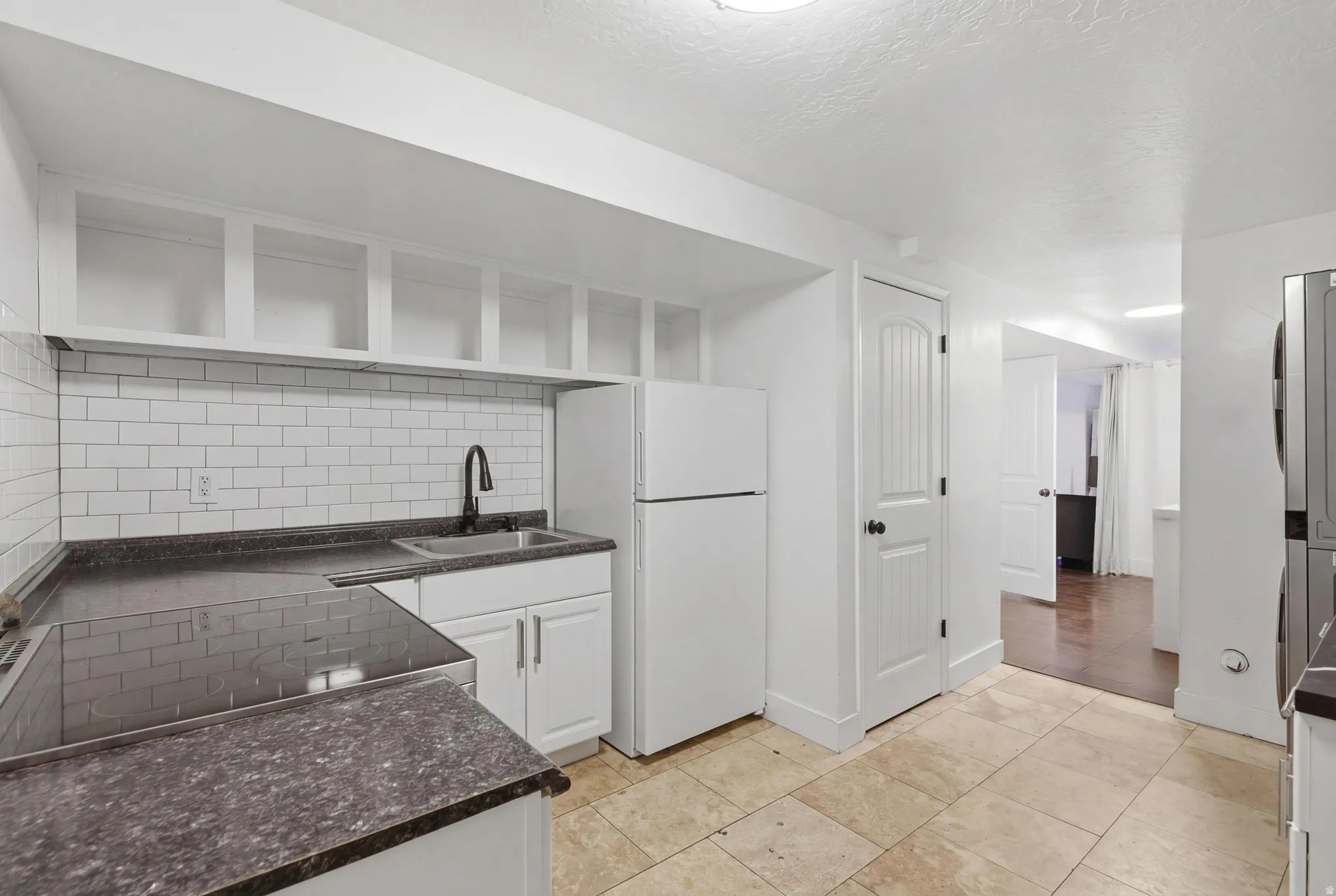 Basement kitchen with laundry.