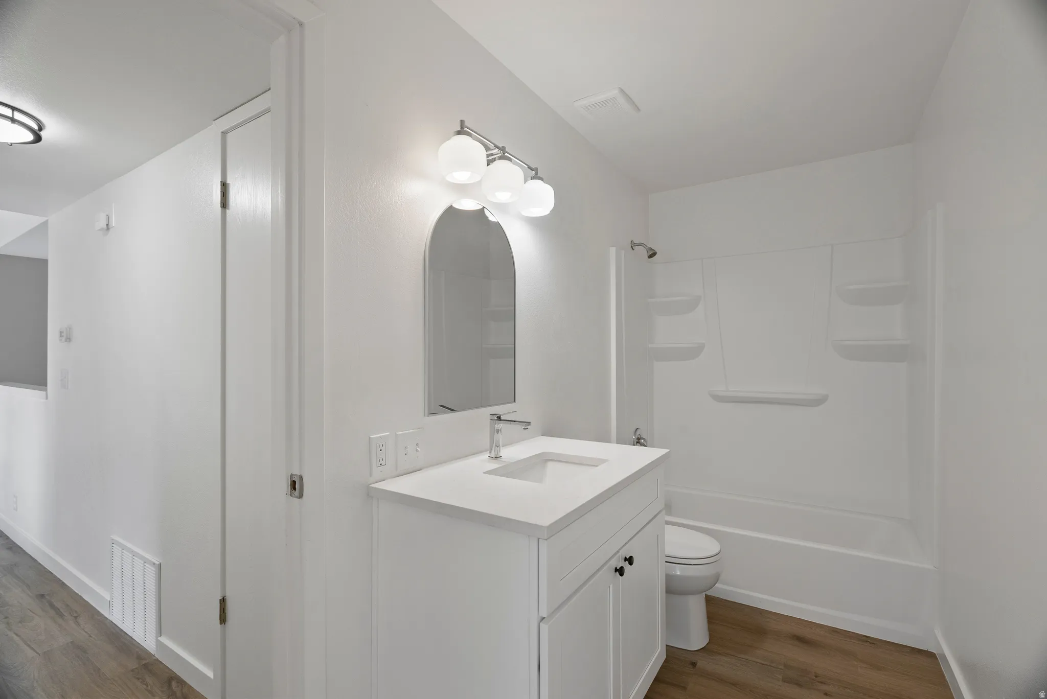 Bathroom all completely renovated. New tub and rub surround, new shower hardware, new vanity, new light, new mirror.