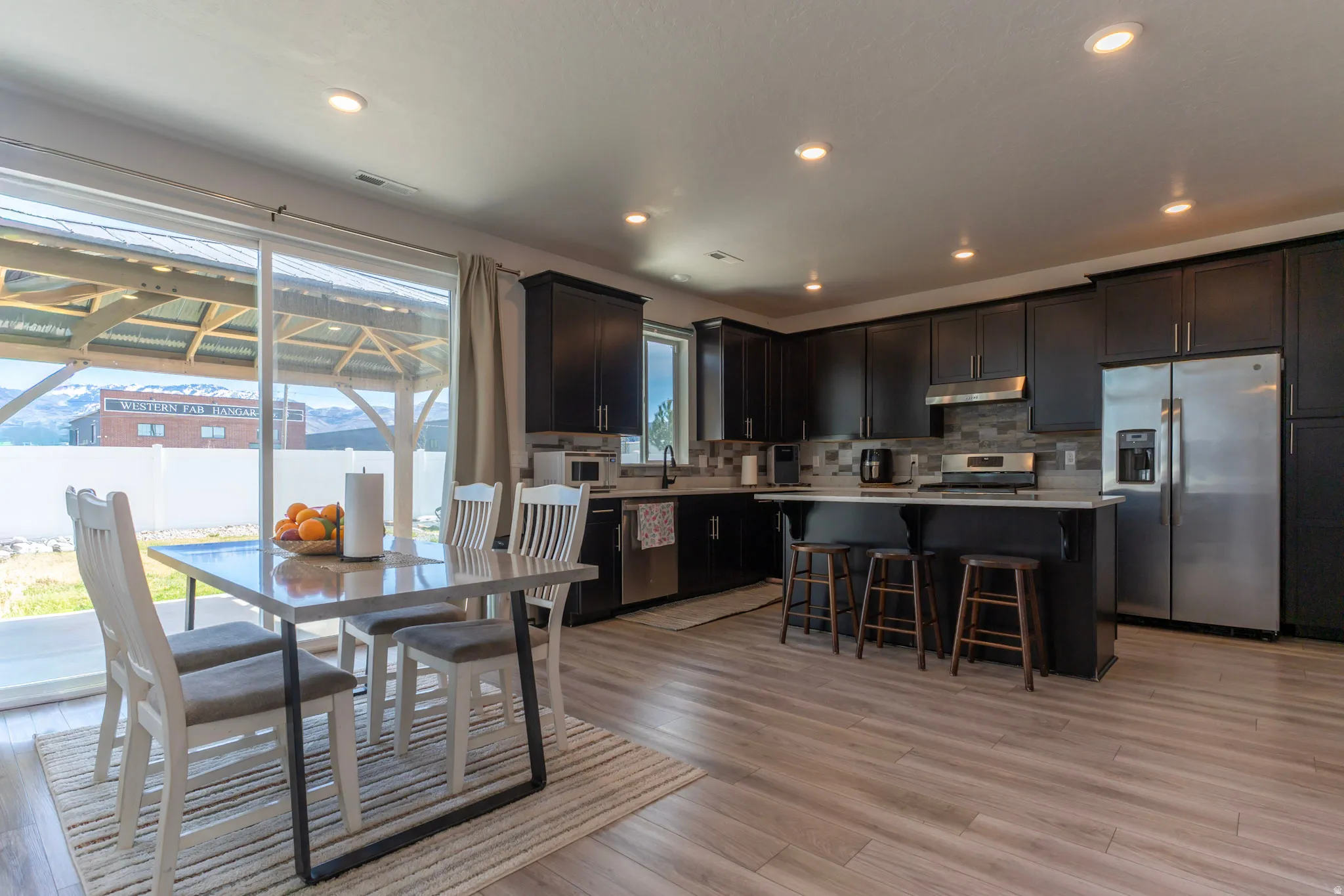 Dining space featuring light wood-style floors and recessed lighting