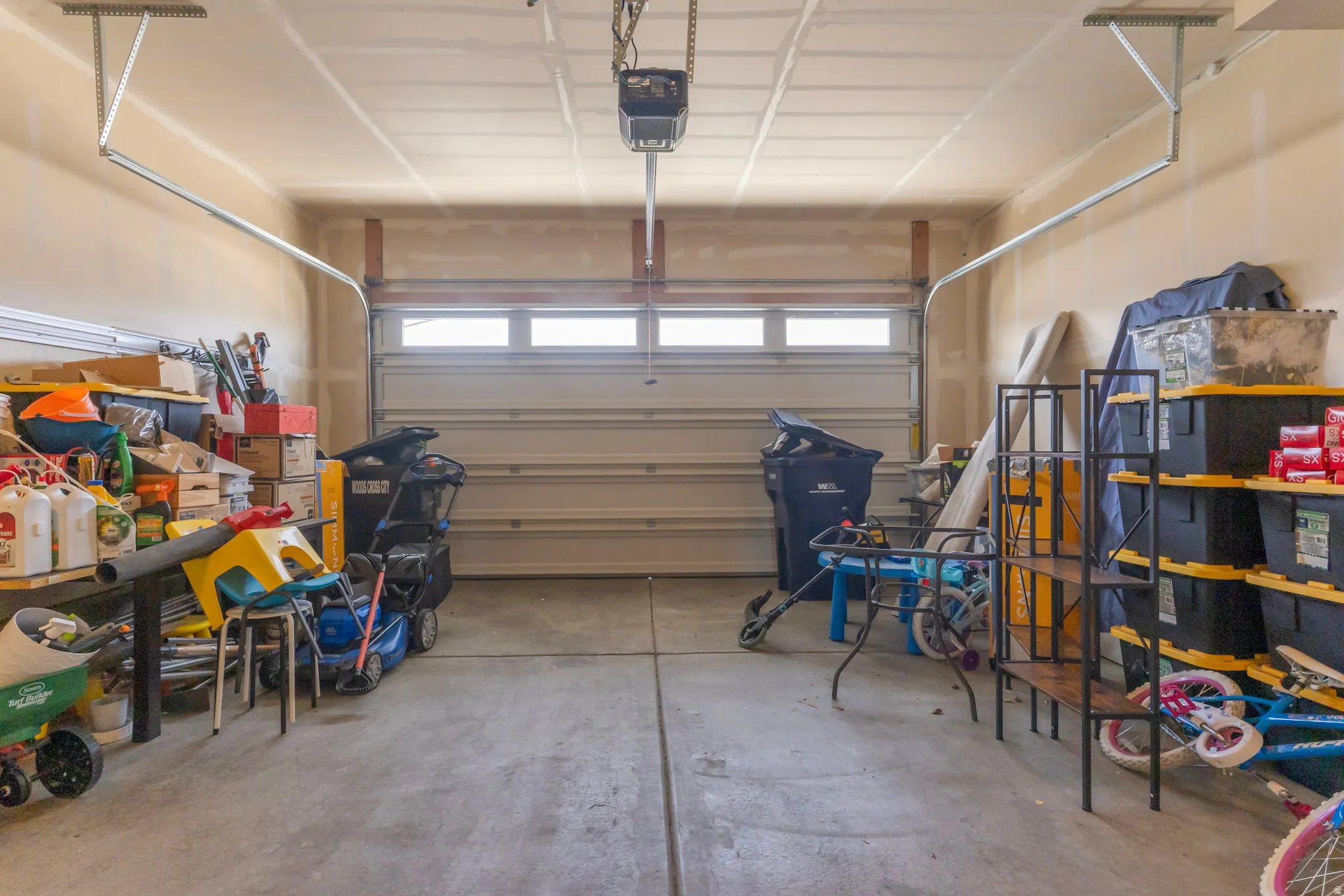 Garage featuring a garage door opener