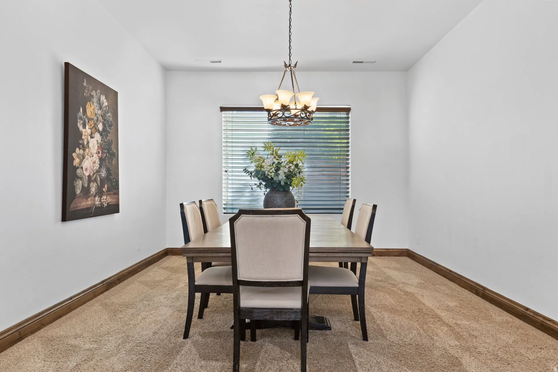 Dining room with carpet flooring and suspended lighting