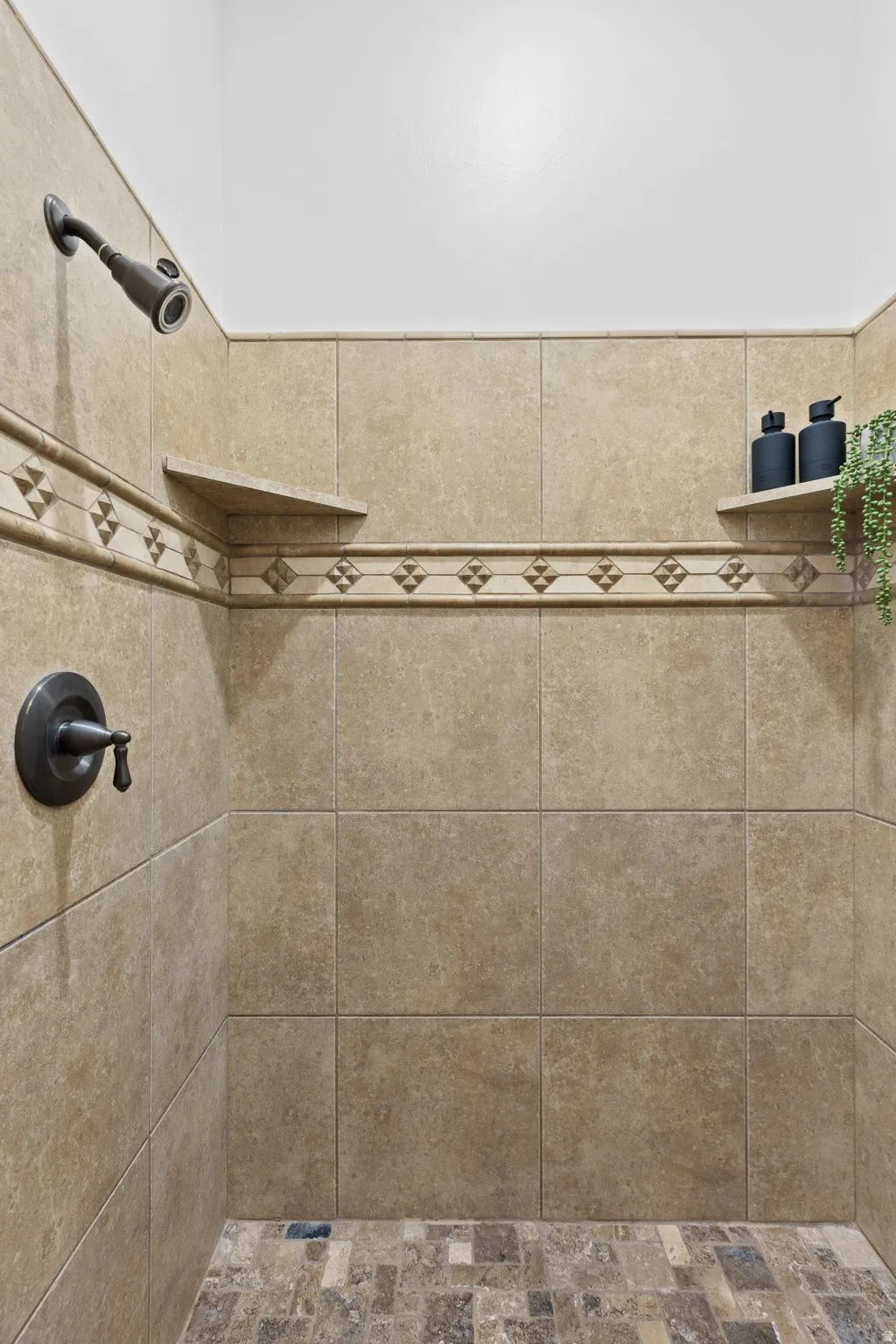 Bathroom view of a tile shower