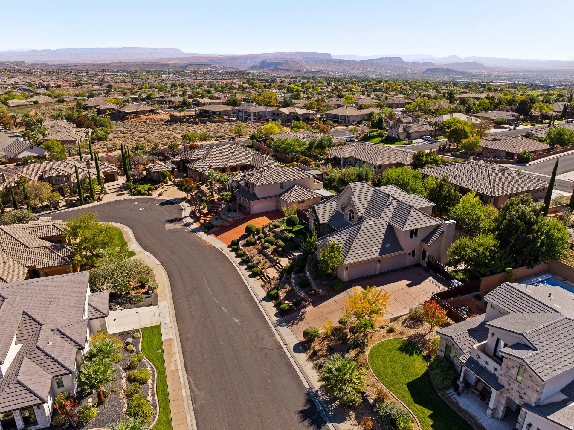 Aerial view of residential area featuring a mountainous background