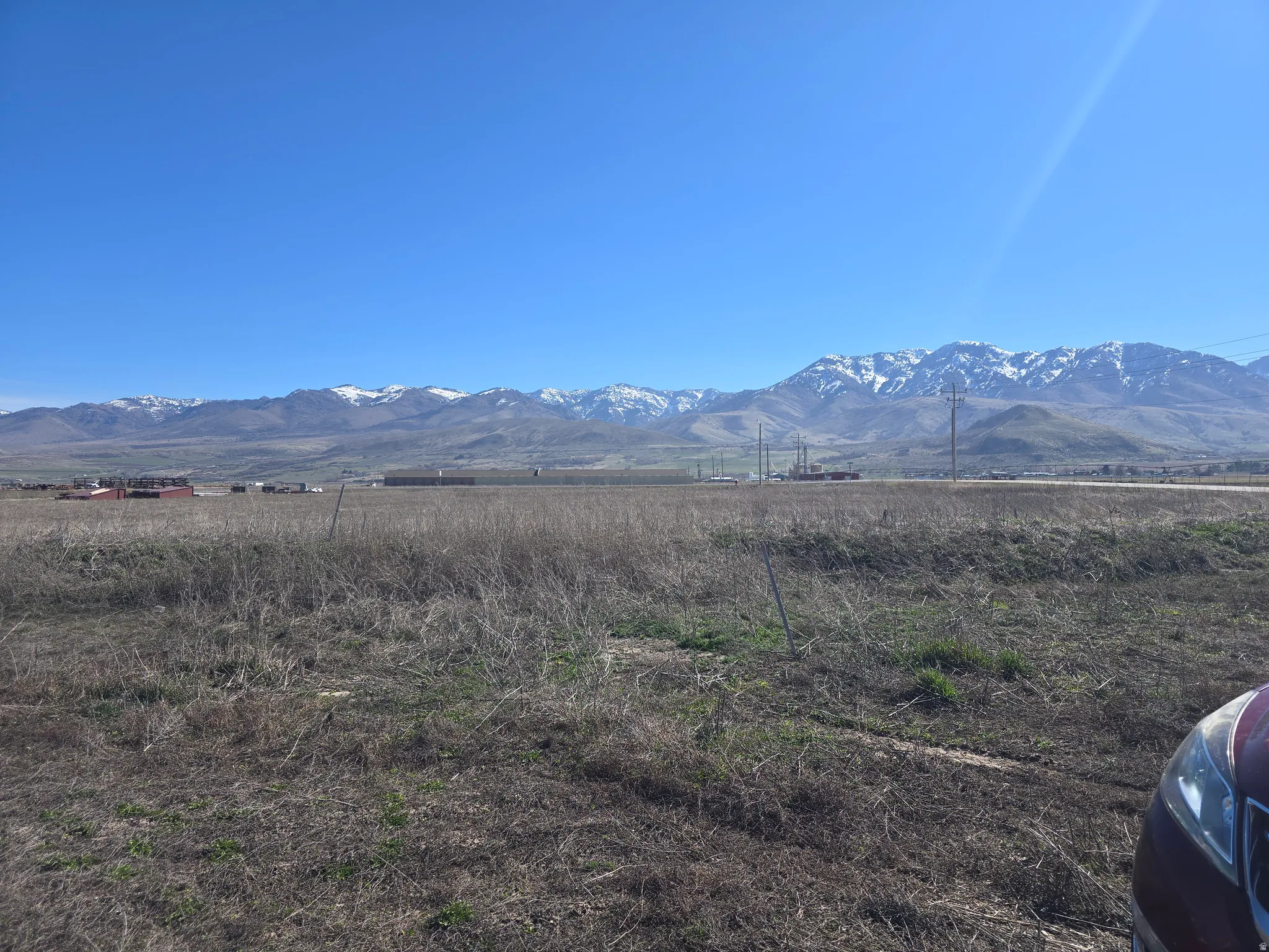 View of mountain background featuring rural landscape