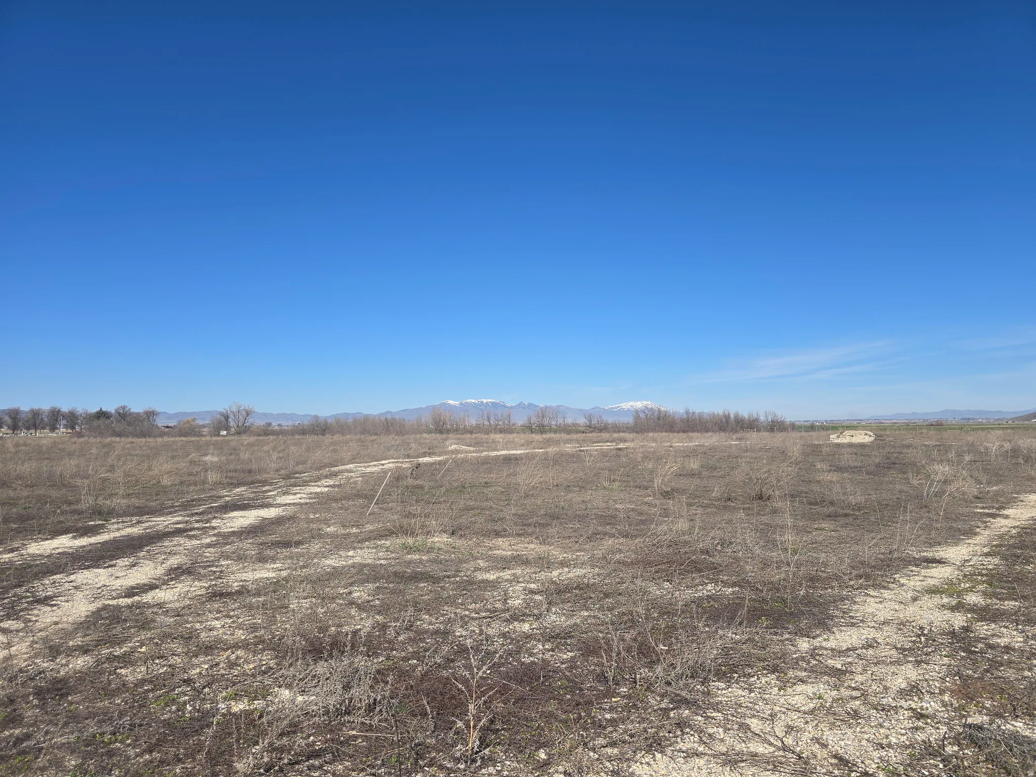 View of undeveloped land with rural landscape and a mountain backdrop