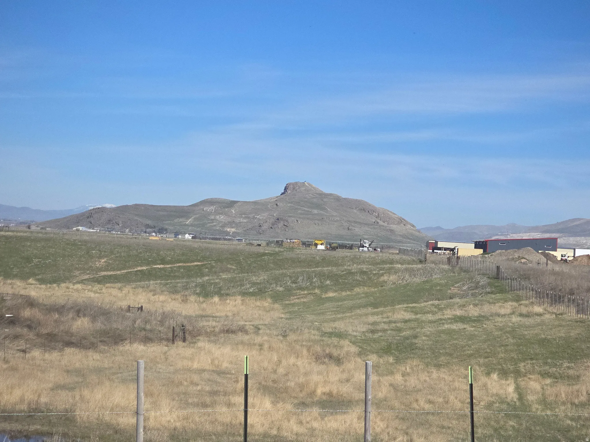 View of mountain background featuring rural landscape