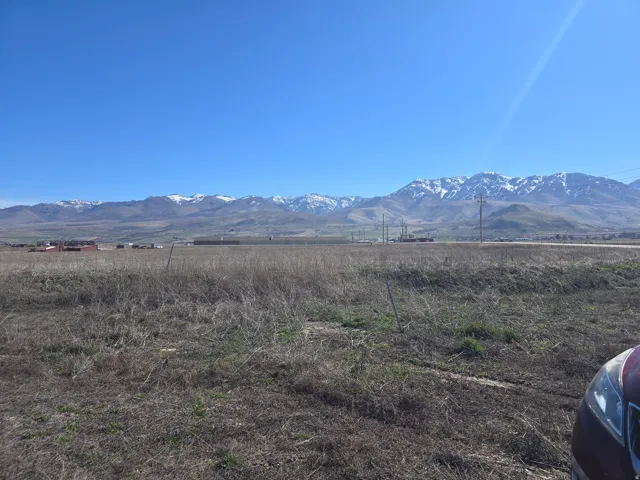 View of mountain background featuring rural landscape