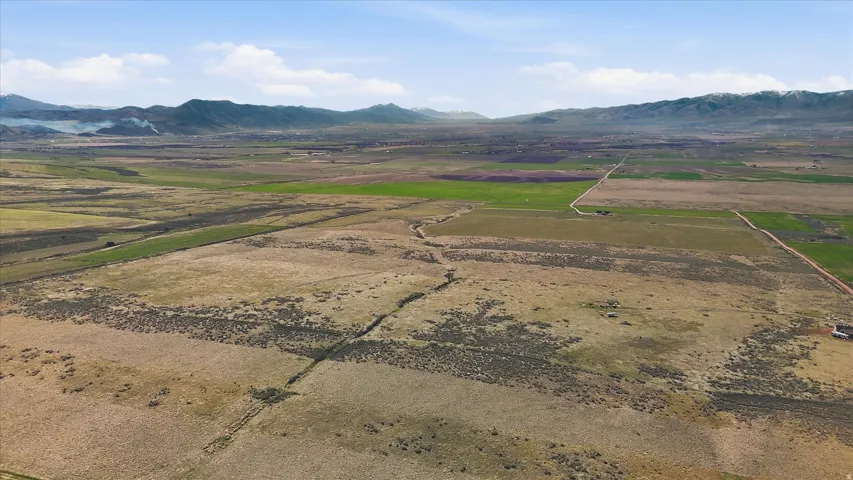 View of mountain backdrop featuring rural landscape