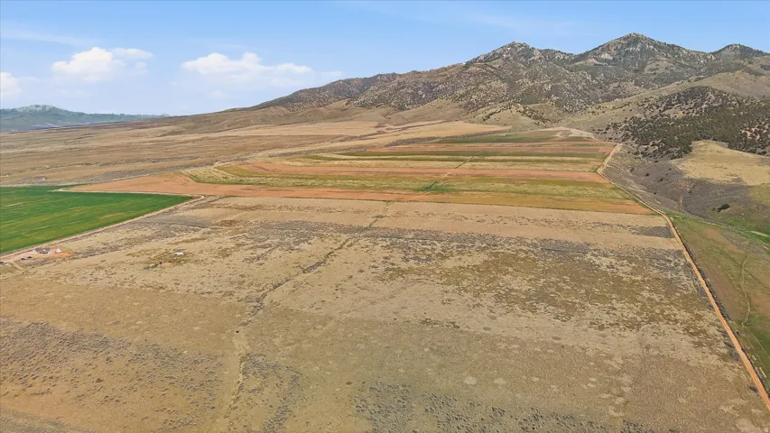 View of mountain background featuring rural landscape