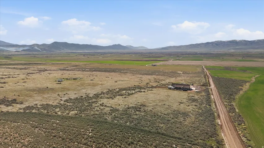 View of mountain background featuring rural landscape