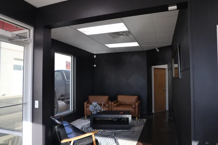 Living area featuring a drop ceiling