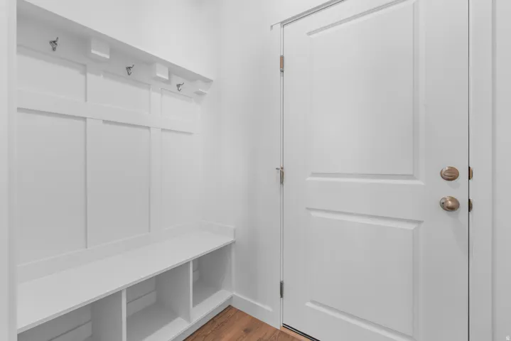 Mudroom with dark wood finished floors