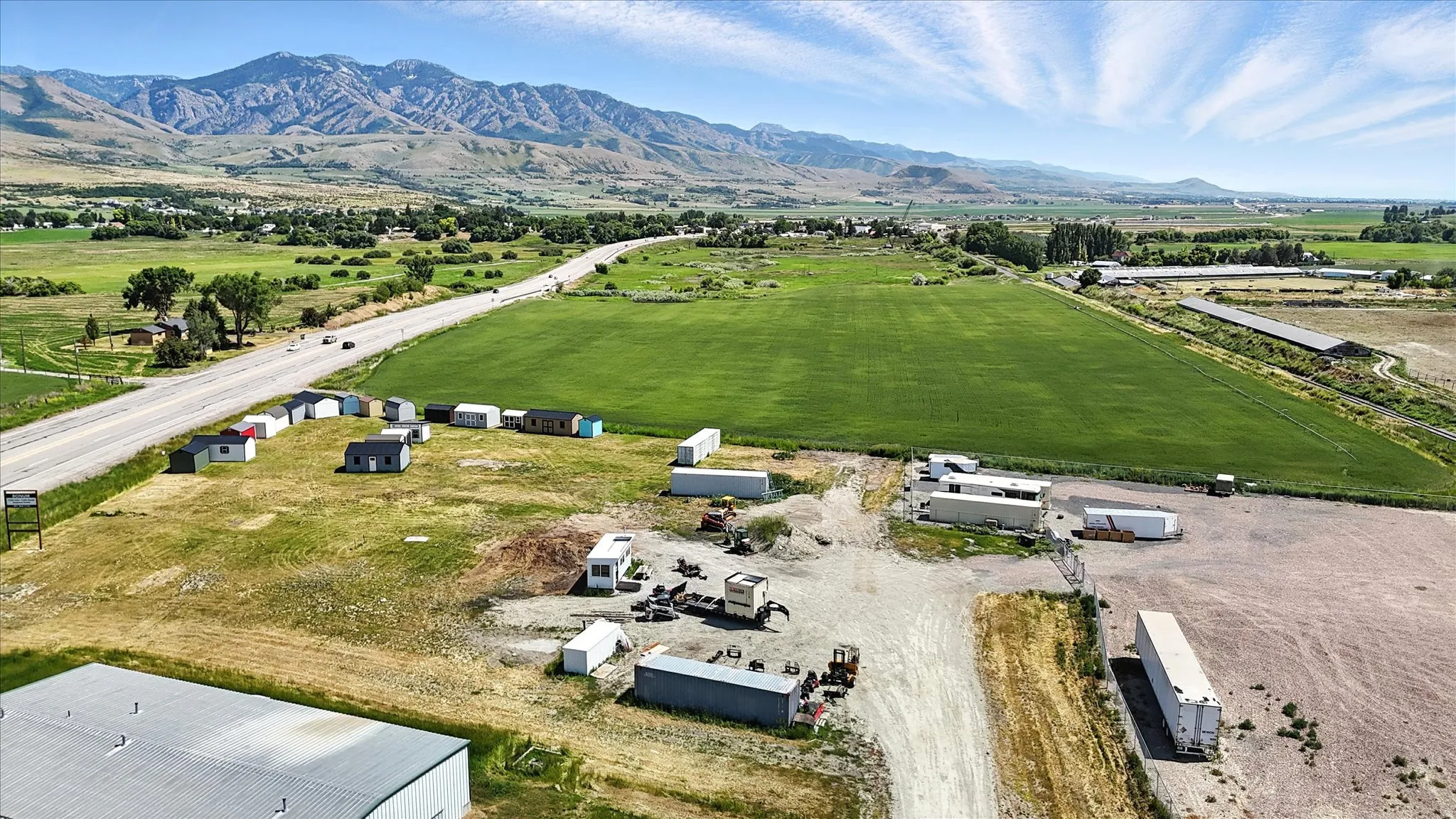 Aerial view of sparsely populated area featuring a mountainous background