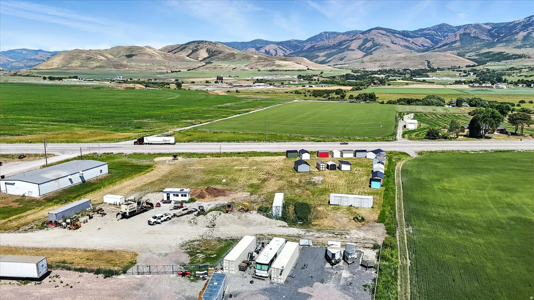 Aerial view of sparsely populated area featuring a mountainous background