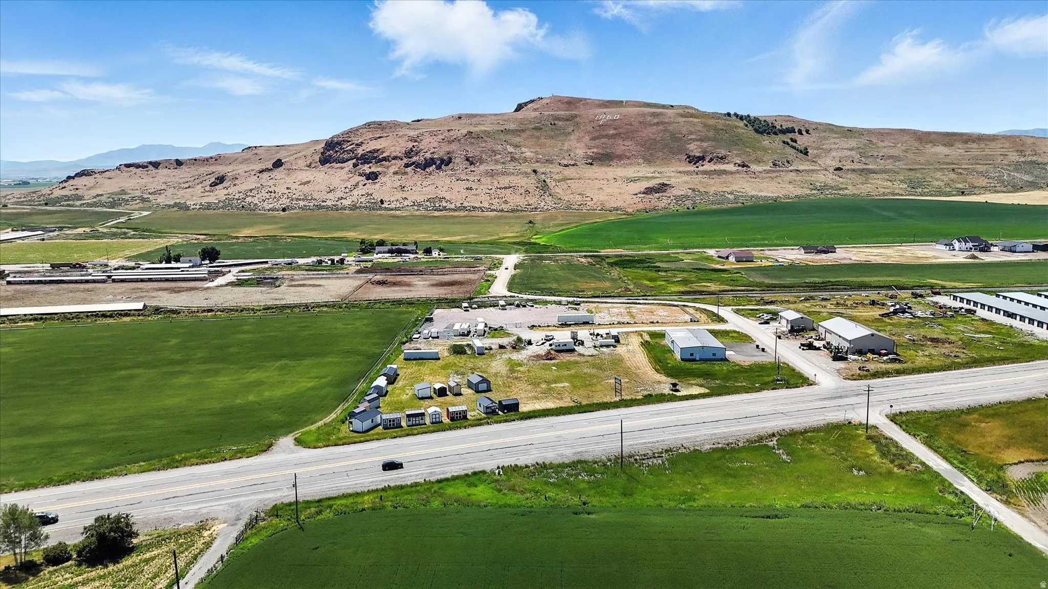 Aerial view of sparsely populated area with a mountain backdrop