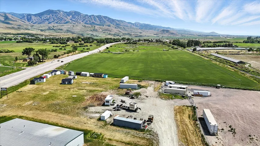Aerial view of sparsely populated area featuring a mountainous background