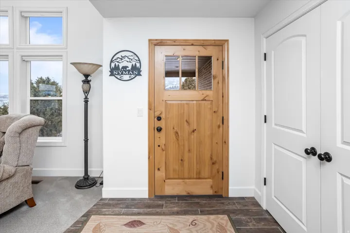 Foyer with wood finish floors and baseboards