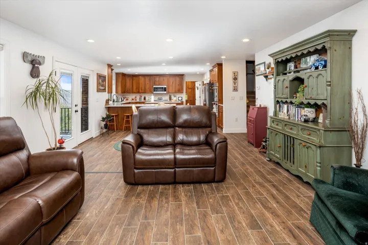 Living area featuring wood tiled floors and recessed lighting