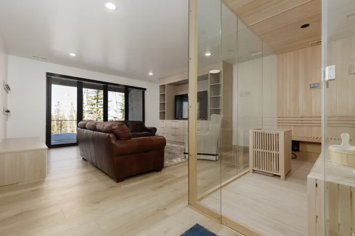 Family room with light wood-style flooring and recessed lighting and an 8 person sauna
